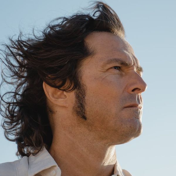 Person stretching outdoors, feeling refreshed and full of life.